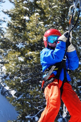 Hanging on tight on the zipline at Vail. 